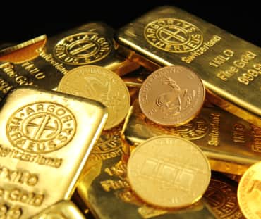 Lingotes y monedas de oro